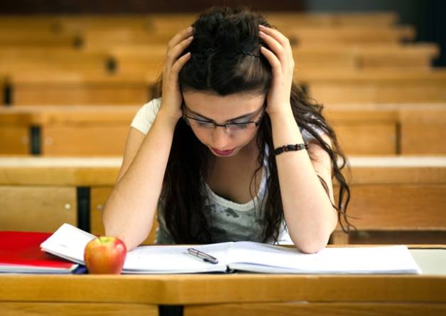 Teen with full schedule Photo of a teen taking too much stress with her studies
