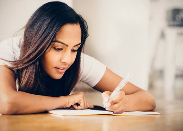 Photo of young teen making money management plans
